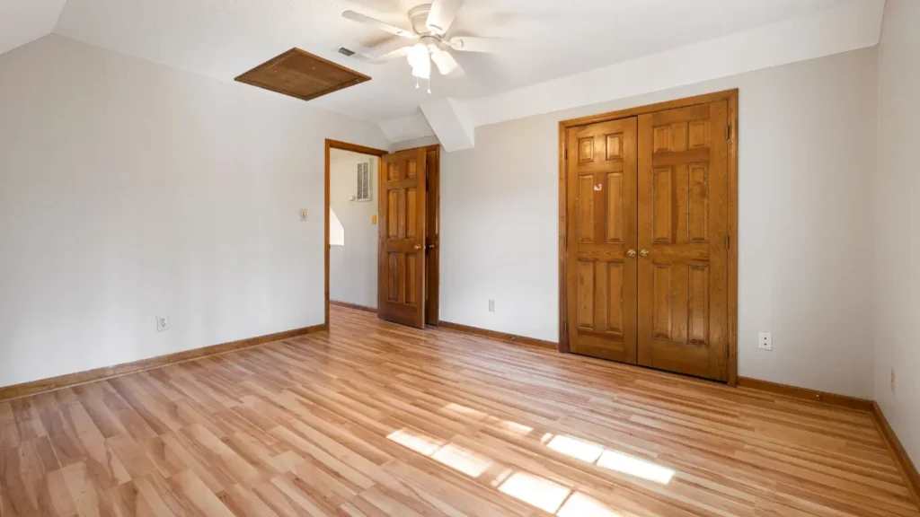 Parquet Flooring in the UAE: Types, Benefits, and Complete Guide for Homes and Offices 4 Cleaning and polishing parquet flooring in a UAE home-vivid curtains