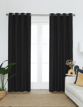 Eyelet blackout curtains in Abu Dhabi for homes and offices, offering easy installation, full light control, and modern style
