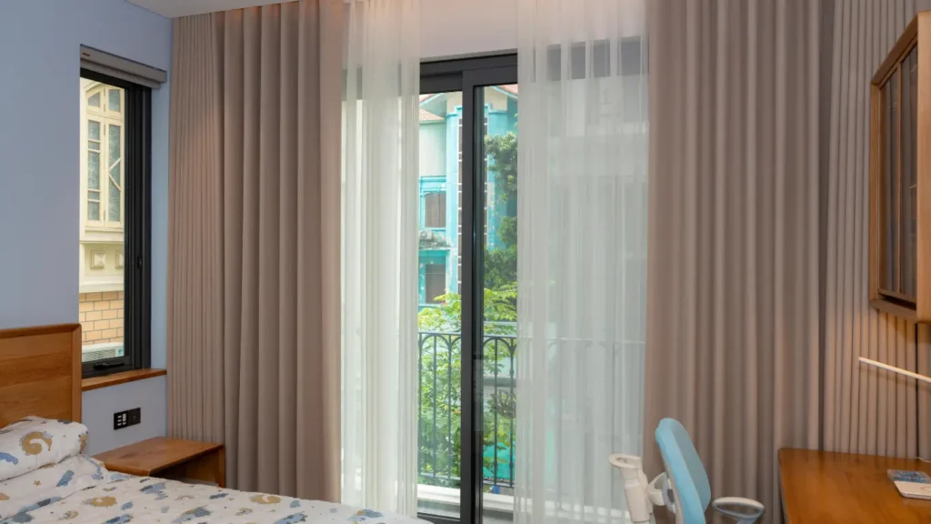Beige sheer curtains installed in modern villa in Abu Dhabi