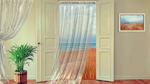 Layered sheer and blackout curtains in Abu Dhabi bedroom