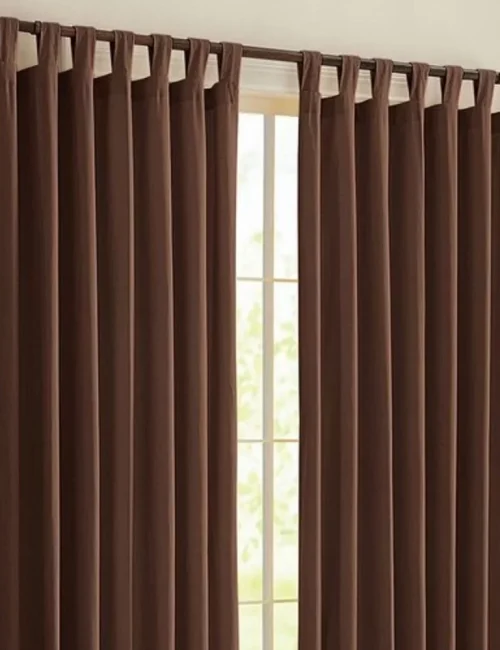 Modern ring curtains installed in an Abu Dhabi home, featuring smooth glide rings and premium fabric for a sleek and elegant interior look.